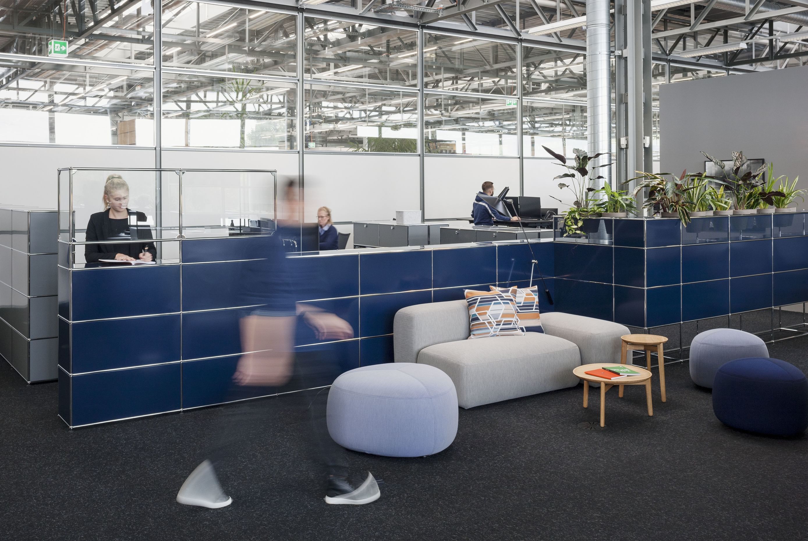 Haller World of Plant's metal panel, horizontally integrates plant pots directly into the furniture system, with pot recesses, in a subtle and discreet manner.